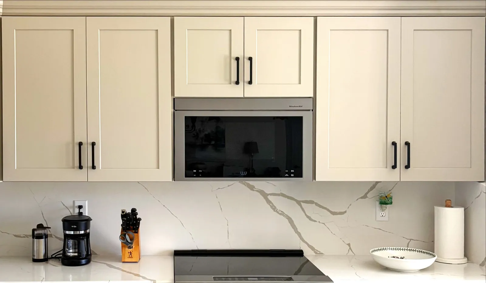 New white shaker kitchen cabinets with built-in microwave in Marion County, FL